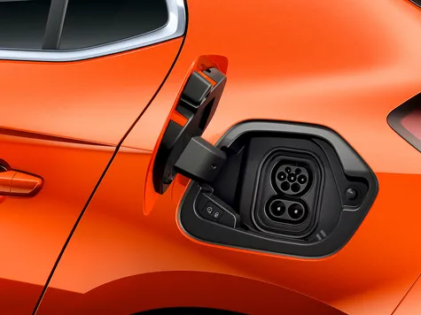 Opel Corsa-e Elektroauto in der Farbe orange Ansicht des Ladeports Opel Corsa-e Elektroauto in der Farbe orange Ansicht des Ladeports